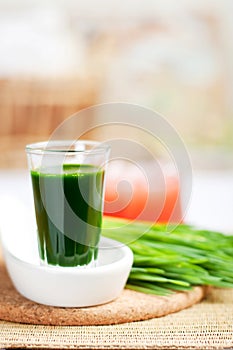 Shot of wheatgrass juice photo