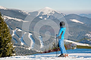 Skier resting on top of the mountain