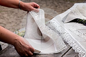 Shot of linen tablecloth and napkins with lace trim