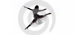 Shot of young graceful ballerina jumping while dancing isolated on white