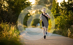 Shot of a young male athlete training on a race track