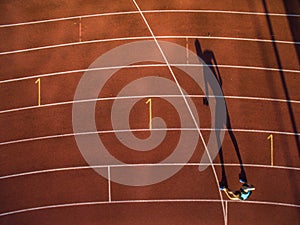 Shot of a young male athlete training on a race track