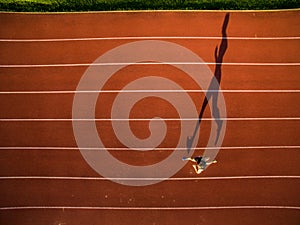Shot of a young male athlete training on a race track