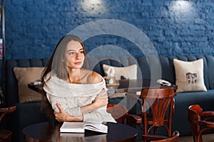 Shot of a young stylish woman using a digital tablet in a cafe Coffee and a great book. Life`s good