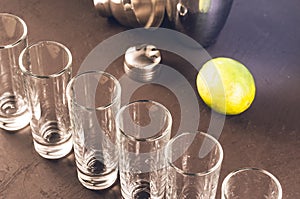 Shots ready for alcohol on bar/shots ready for alcohol and lime on bar