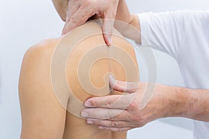 shoulder blades physiotherapist manipulation in doctors hospital office