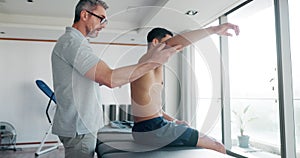Shoulder injury, test or man in physiotherapy to relax body for healing arm pain in rehabilitation. Physical therapy