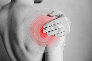 Shoulder and joint injuries, fatigue at work. Area of the injury, the image on a clean background. photo