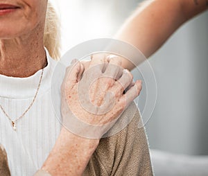 Shoulder, old woman or nurse holding hands in hospital consulting about medical test news or results for support