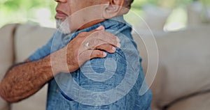 Shoulder pain, stress and hands of senior man on sofa with muscle, problem or arthritis crisis at home. Arm, injury and