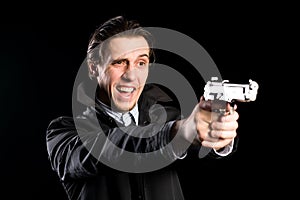 Shouting man firing a pistol