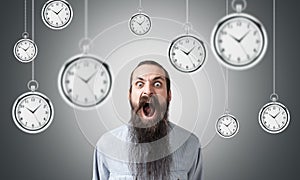 Shouting man and hanging clocks