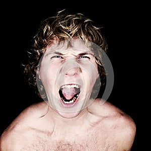Shouting man isolated over black