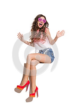 Shouting Woman In Pink Sunglasses Sitting On A Top