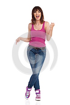 Shoutng Young Woman Is Standing And Pointing Down