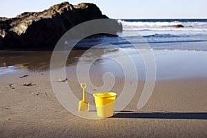 Shovel and bucket on beach