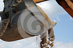 Shovel bucket full of sand