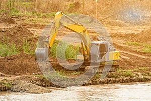 Shovel bucket on river bank , lift loads, construction machinery