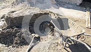 Shovel with a cement. Construction site