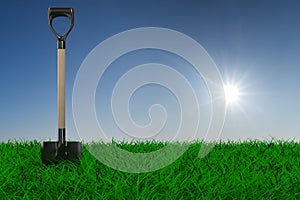 Shovel on grass. garden tool photo