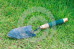 shovel on green grass field