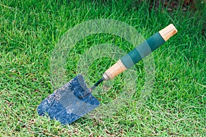 shovel on green grass field