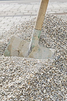 Shovel in a heap of grit