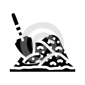 shovel in heap of peat glyph icon vector illustration