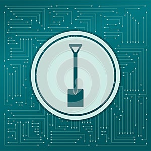 Shovel icon on a green background, with arrows in different directions. It appears on the electronic board.