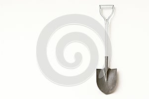 Shovel on a light background. Space for text.