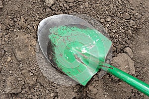 Shovel lying in dirt