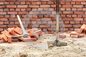 Shovel and pickaxe on a construction site