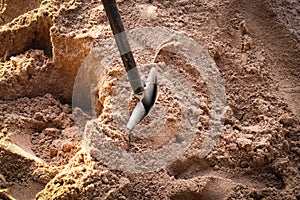 Shovel in the sand for construction.