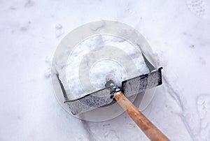 Shovel for snow cleaning in snow photo