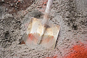 Shovel in Wet Concrete