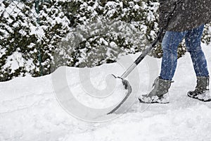 Shoveling snow on pavement