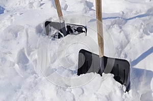 Shovels stuck in snowdrift