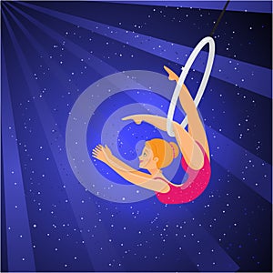 Show in the circus. Girl acrobat performs a trick on the ring