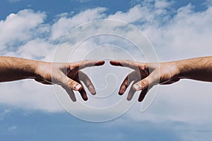 show hand of man with forefinger reach for point and touch against sky - Connection