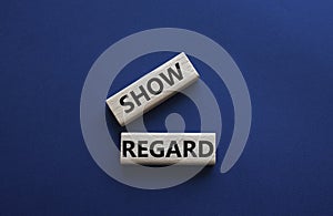 Show regard symbol. Wooden blocks with words Show regard. Beautiful deep blue background. Business and Show regard concept. Copy