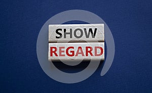 Show regard symbol. Wooden blocks with words Show regard. Beautiful deep blue background. Business and Show regard concept. Copy