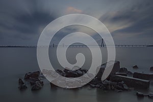 Show shutter Image of Bandra-worli Bridge taken from Shivaji Park Beach at Twilight in Mumbai,Maharashtra,India