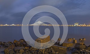 Show shutter Image of Bandra-worli Bridge taken from Shivaji Park Beach at Twilight in Mumbai,Maharashtra,India