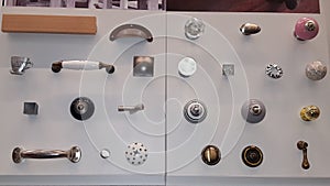 Showcase of many closet door handles designed doorknobs on wooden board for sale in shop photo