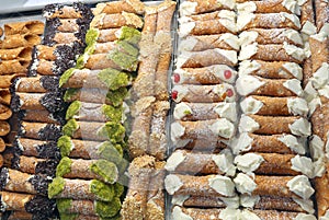 Showcase of pastry with Sicilian cannoli made with ricotta pista