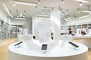 Showcase with smartphones in the modern electronics store. Buy a mobile phone