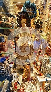 A showcase with Venetian masks, expensive carnival decorations, a souvenir from Venice