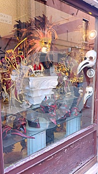 A showcase with Venetian masks, expensive carnival decorations, a souvenir from Venice