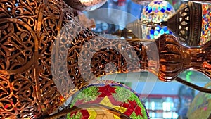 Showcase of vintage Turkish Turkish lamps have a multi-colored mosaic on them, they glow from the middle, shining