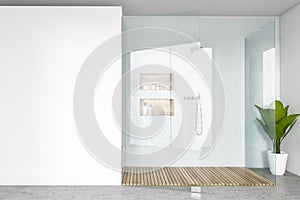 Shower cabin in white bathroom